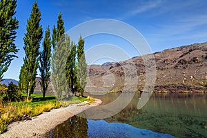 Green grassy lawn by the lake