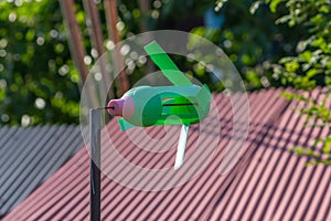 A Green handmade Plastic Windmill