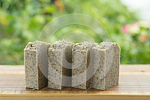 Green handmade scrub soap with wormwood and thyme.