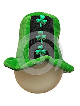 Green hat with shamrock on a round shape sponge head, white background, isolated, Saint Patrick day celebration