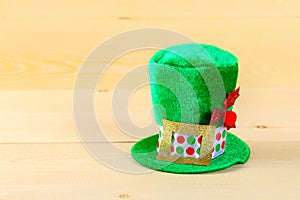 A green hat on a wooden table. St. Patrick's Day.