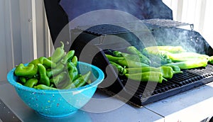 Green Hatch chili being roasted on the grill.