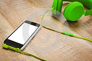 Green headphone with a back smartphone