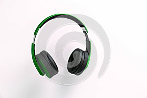 Green headphone isolate on white background