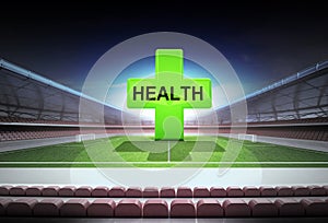 Green health cross in midfield of magic football stadium