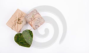 Green heart and gifts. Romantic concept. Natural Valentine card. St. Valentine`s Day. Copy space