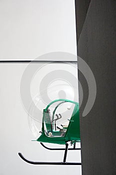 Green helicopter inside building
