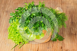 Green herbs in a pounder photo