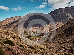 Green high atlas mountain valley and mountain village of Tacheddirt near Imlil in Morocco