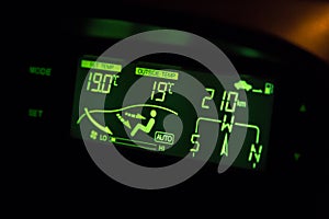 Green highlighted car air conditioner control panel