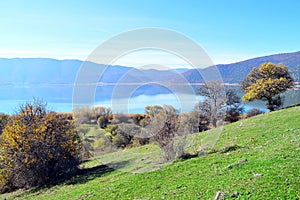 Green hills and a lakescape