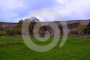 Green hills and an old stone farm house near Black Mountains, Brecon Beacons , Wales, UK