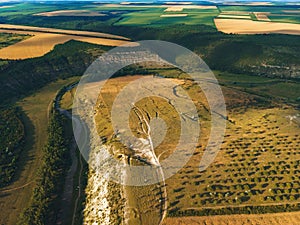 green hills, wheat fields and river curve