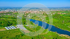 Green hilly landscape and city in the distance