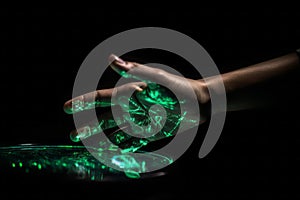 Green hologram of human hand on dark background. Generate ai