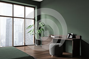 Green home office corner with pouffe