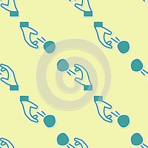 Green Hooligan shooting small stones icon isolated seamless pattern on yellow background. Demonstrator. Vector photo