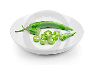 Green hot chili pepper in plate on white background