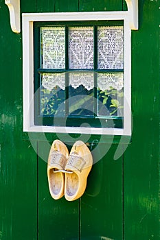 Green house with clogs