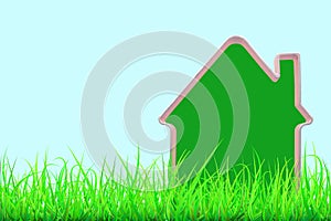 Green house model in green grass against blue sky background. Green house concept