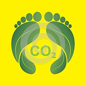 Green human footprints made of leaves with the word CO2, carbon footprint concept