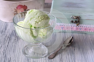 Green ice cream in a glass vase. Pistachio ice cream.