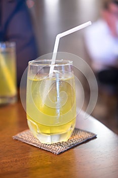 Green ice tea in glass put