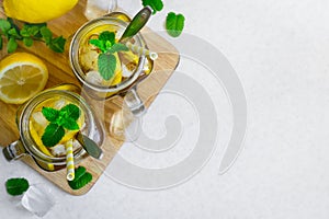 Green ice tea with lemon and mint in a glass jar. Top view with