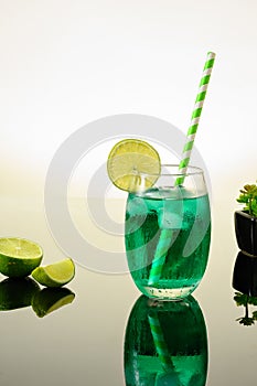 GREEN ICED DRINK DECORATED WITH LEMON