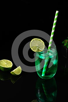 GREEN ICED DRINK DECORATED WITH LEMON