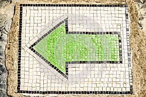 Green index arrow from a mosaic on the floor in the castle of St. Peter, Turkey.