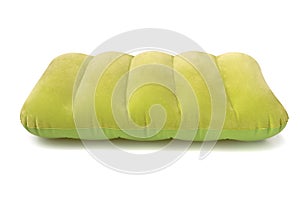 Green inflatable pillow isolated on a white background with clipping path. Holidays concept