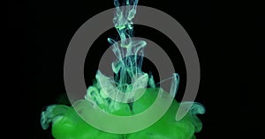 Green Ink Colors in Water Creating Liquid Art Shapes