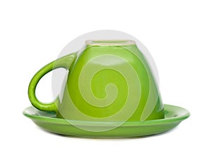 Green inverted cup on a saucer.