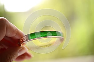 Green jade inserted in a gold bracelet