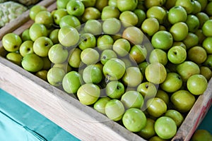 Green jujubes on wooden box in the fruit market Asian - Monkey Apple fruit