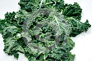 Green kale in ceramic bowl. Selective focus. Top view