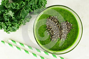 Green kale smoothie with chia seeds heart