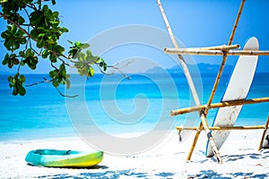 A Green Kayak On The Beach