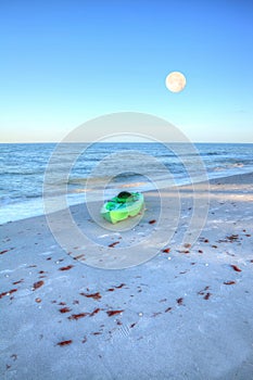 Green kayak on the white sand of Tigertail Beach in Marco Island photo