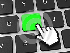 Green key and hand cursor on keyboard of laptop computer.