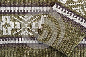 Green knitted sweater with geometric ornament detail