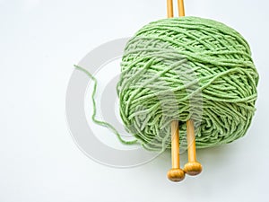 Green Knitting yarn on white background