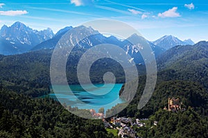 Green lake mountain view blue sky