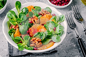 Green Lambâ€™s lettuce corn salad with blood oranges, walnuts, pomegranate and chia seeds