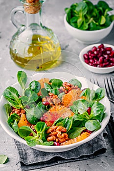 Green Lambâ€™s lettuce corn salad with blood oranges, walnuts, pomegranate and chia seeds