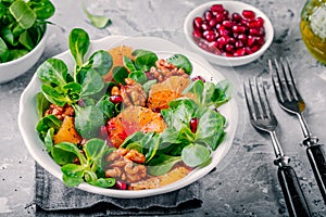 Green Lambâ€™s lettuce corn salad with blood oranges, walnuts, pomegranate and chia seeds