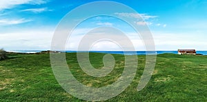 Green landscape of a golf course by the coast