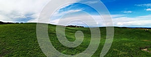 Green landscape of a golf course by the coast