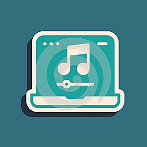 Green Laptop with music note symbol on screen icon isolated on green background. Long shadow style. Vector